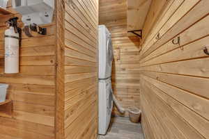 Sauna / steam room featuring wood walls and wood finished floors