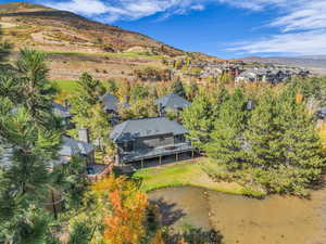 Aerial perspective of suburban area featuring a water and mountain view
