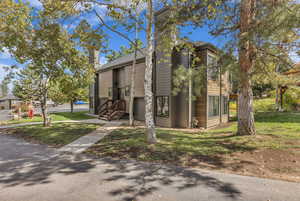 View of front of house with a front yard and a chimney