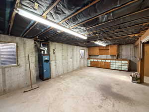 Unfinished below grade area with heating unit