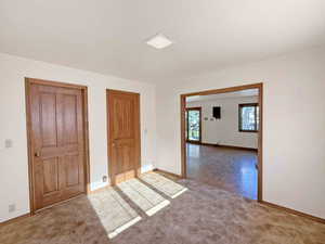 Office off the family room with attached half bath and double pocket doors.