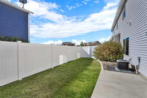 Fenced backyard with a patio area
