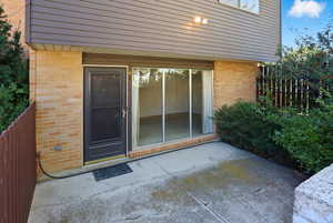 Front entrance to property with a patio area