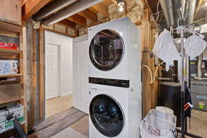 Laundry area with stacked washer / dryer