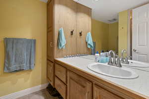 Bathroom with vanity and light tile patterned flooring