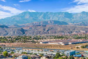 View of mountain background featuring nearby suburban area
