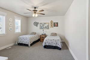 Bedroom featuring carpet floors and ceiling fan