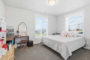 Carpeted bedroom with baseboards