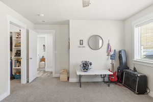 Playroom with light carpet and baseboards