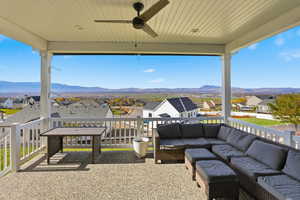 View of patio featuring a residential view, ceiling fan, and a mountain view