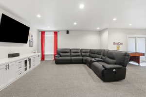 Living area with light colored carpet, recessed lighting, and billiards
