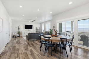 Dining area with recessed lighting, wood finished floors, and a ceiling fan