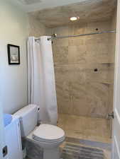 Full bathroom with a shower stall and vanity