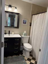 Full bath featuring vanity and a shower with shower curtain