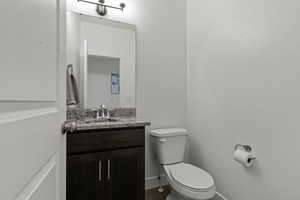 Bathroom featuring vanity and toilet