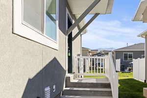 View of property exterior with stucco siding and a mountain view