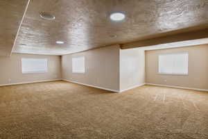 Basement living room with enough room for a pool table, foosball and more!