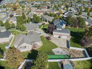 Aerial view of property and surrounding area featuring nearby suburban area