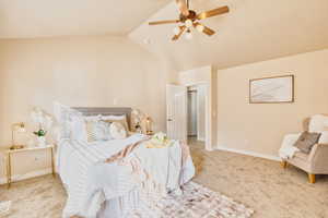 Primary bedroom with vaulted ceiling and ceiling fan