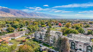 Aerial perspective of suburban area featuring a mountainous background
