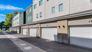 View of building exterior with 2-car garage.