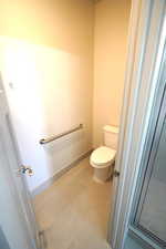 Bathroom featuring baseboards and tile patterned floors