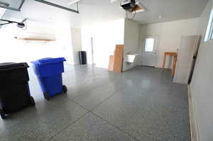 Garage with a garage door opener and a sink