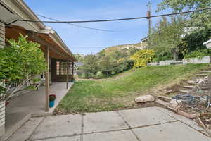 View of yard with a patio