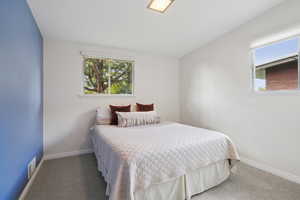 Carpeted bedroom with baseboards