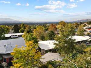 Aerial view of residential area featuring a mountainous background