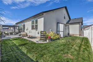 View of property exterior with stucco siding, a patio, a fenced backyard, a gazebo, and an outdoor hangout area
