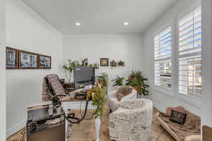 Office area with wood finished floors and recessed lighting