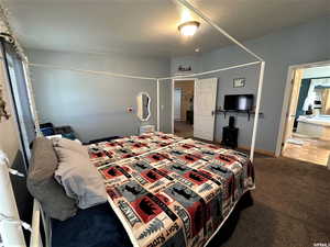 Carpeted bedroom with baseboards