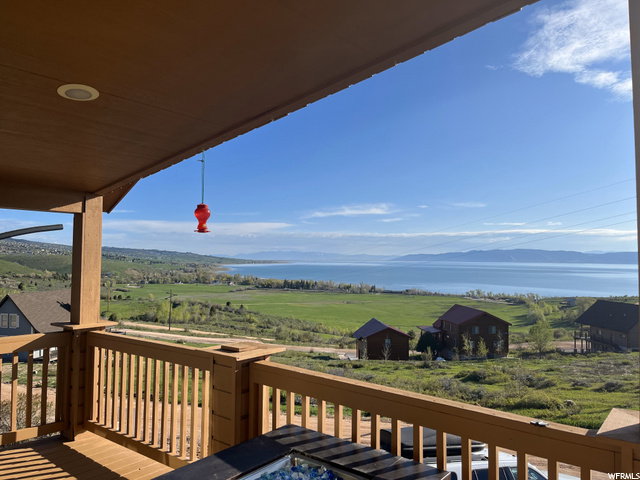 Wooden terrace with a water view and a rural view