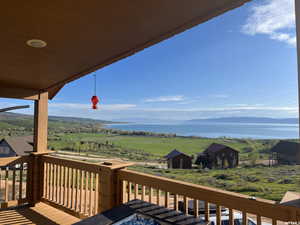 Wooden terrace with a water view and a rural view