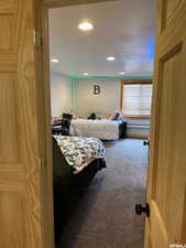 Carpeted bedroom with recessed lighting