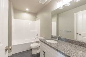 Full bathroom with bathing tub / shower combination, vanity, and recessed lighting