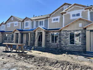 Craftsman house with stone siding and covered porch