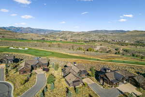 View of property location featuring a mountain backdrop and a golf course