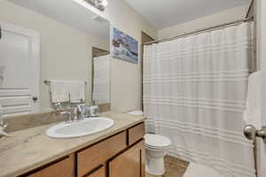 Full bath featuring vanity and light tile patterned floors