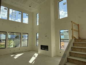 Foyer entrance with a towering ceiling and stairway