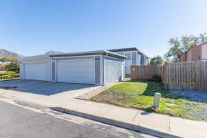 View of front of house with a garage and a mountain view
