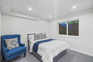 Carpeted bedroom featuring recessed lighting and baseboards