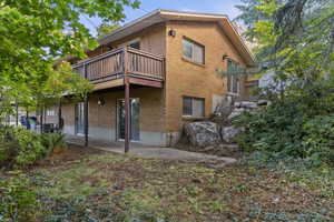 Rear view of property with a patio area