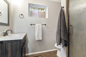Bathroom featuring vanity, a stall shower, LVP Flooring