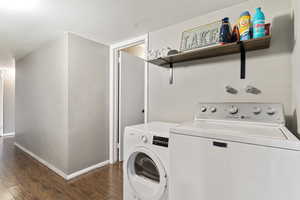 Laundry area featuring LVP Flooring, and included washer/dryer