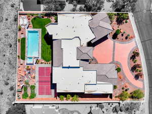 Aerial view of property and surrounding area with a pool area and property parcel outlined