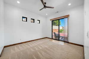 Empty room featuring recessed lighting, carpet flooring, and ceiling fan