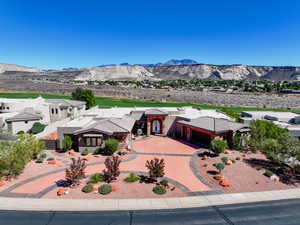 View of front of house featuring a mountain view and driveway