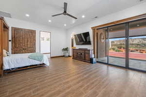 Bedroom with recessed lighting, access to exterior, ceiling fan, and wood finished floors